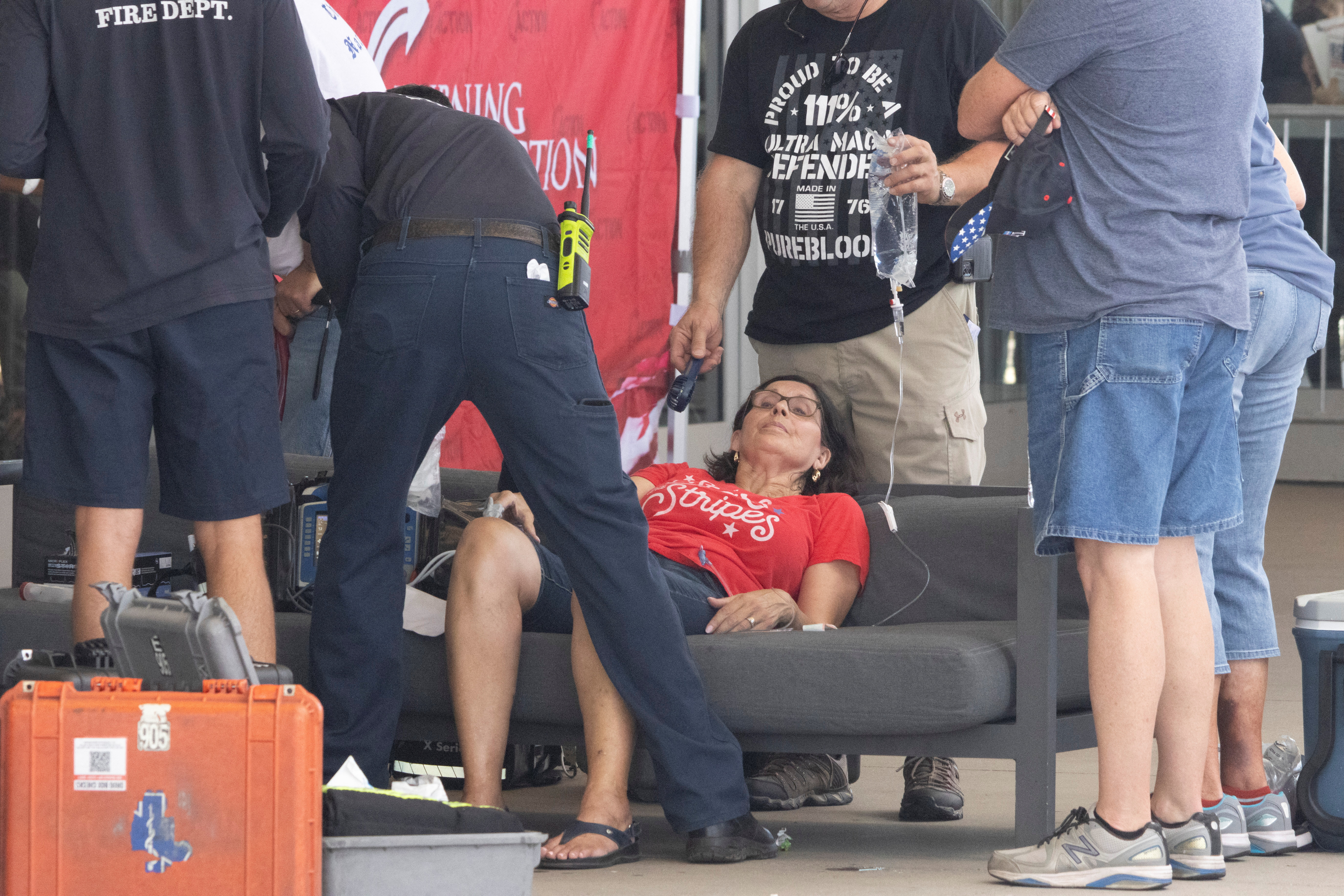 A woman is treated outside the Dream City Church in Phoenix, Arizona